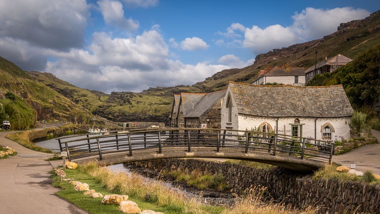Crooked buildings and a bridge across the river in the village of Boscastle, Cornwall